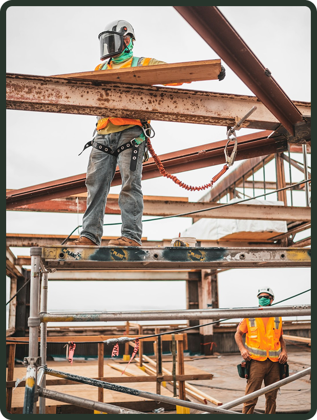 Construction professionals on site reviewing plans